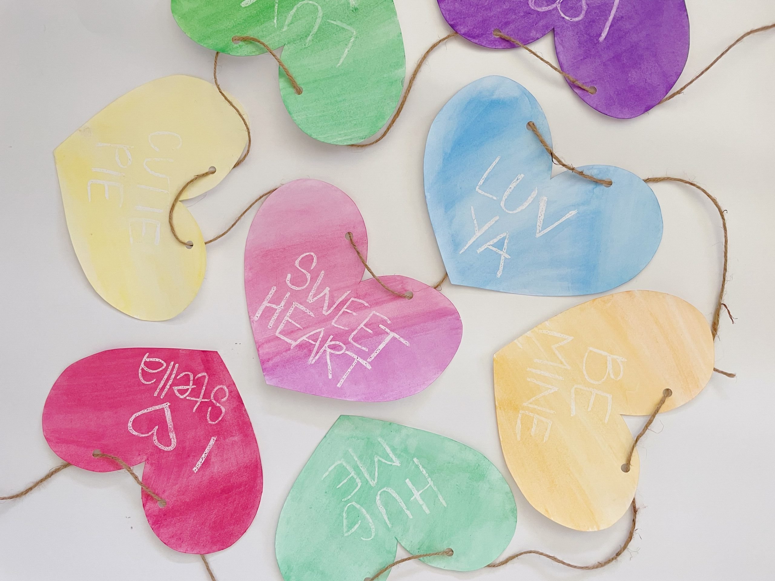 finished valentine's day diy heart garland with colorful designs