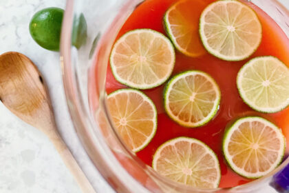 Slices of Lemon with Fruit Juice in a Container