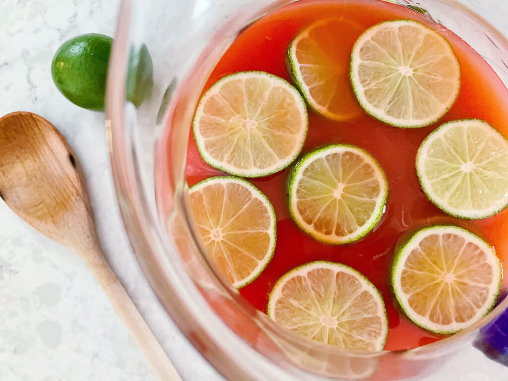 Slices of Lemon with Fruit Juice in a Container
