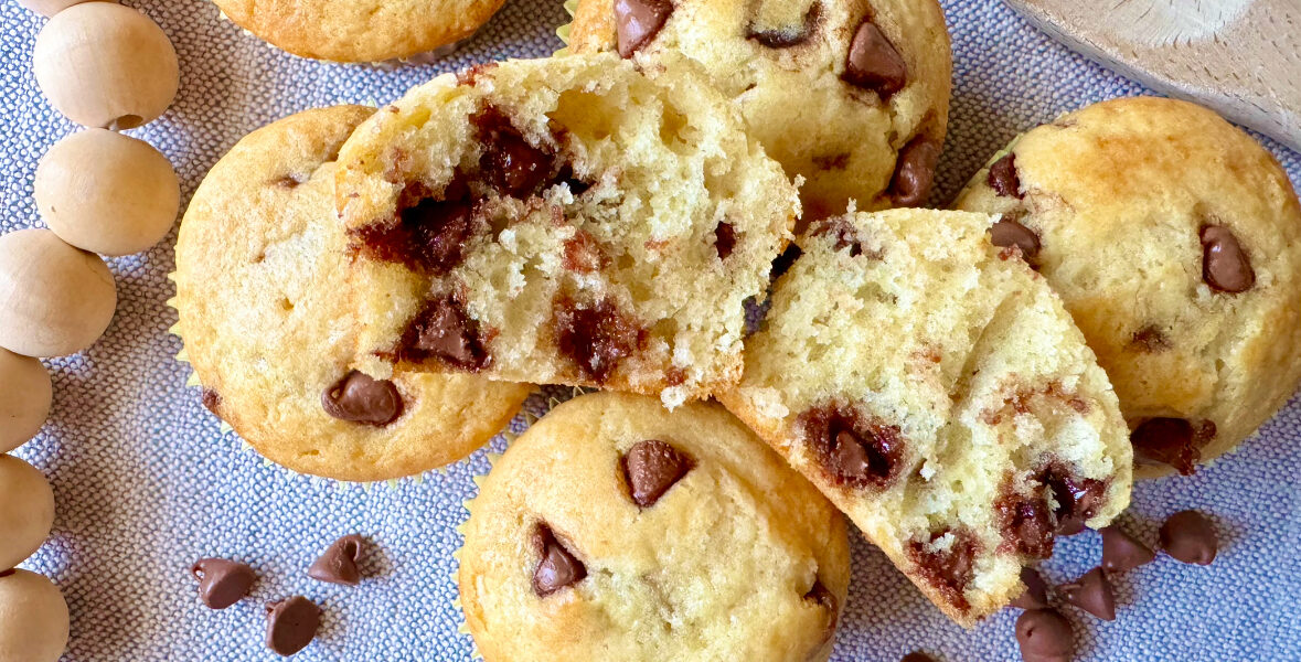 a chocolate chip muffin cut in half to show the middle