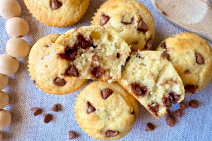 a chocolate chip muffin cut in half to show the middle