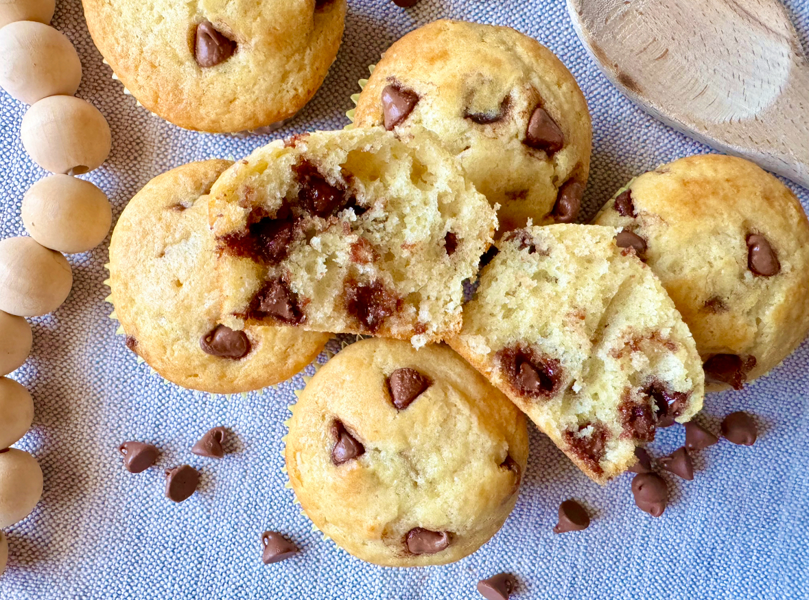 a chocolate chip muffin cut in half to show the middle