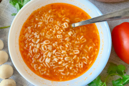 White bowl with alphabet soup