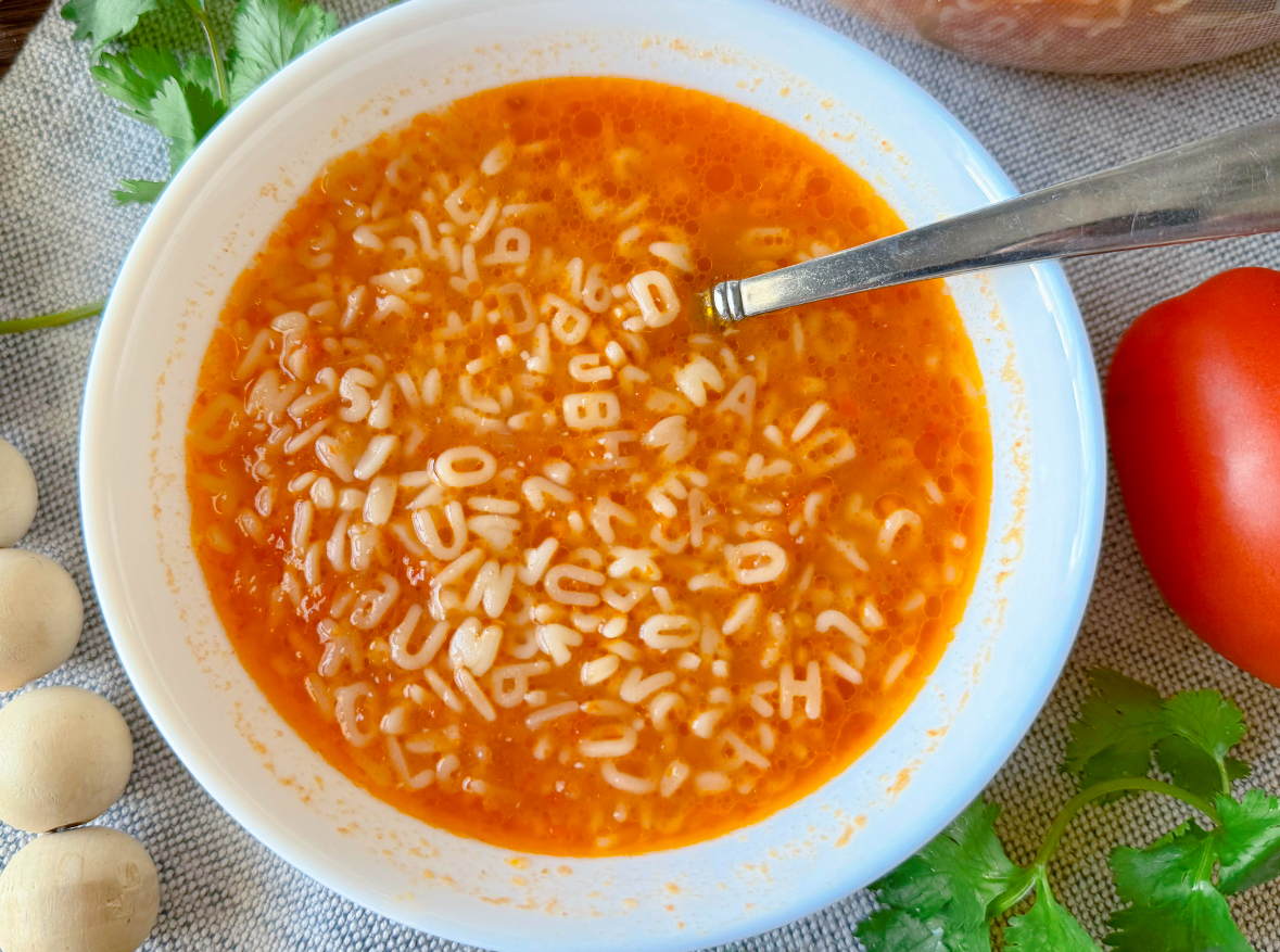 White bowl with alphabet soup