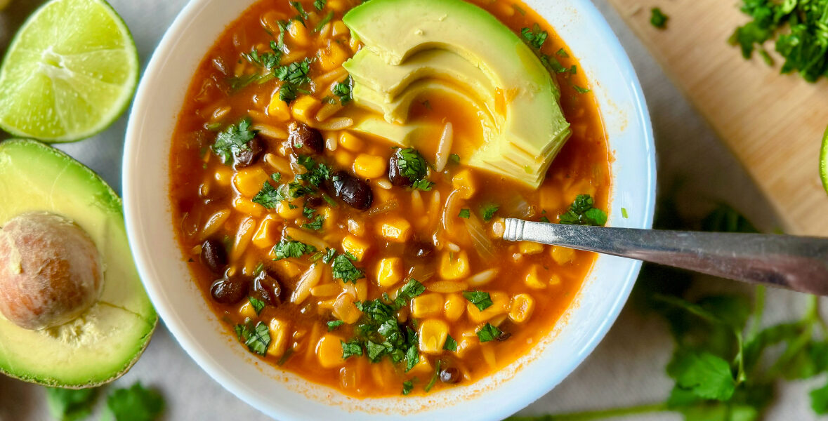 bowl of soup with black beans, corn and orzo pasta