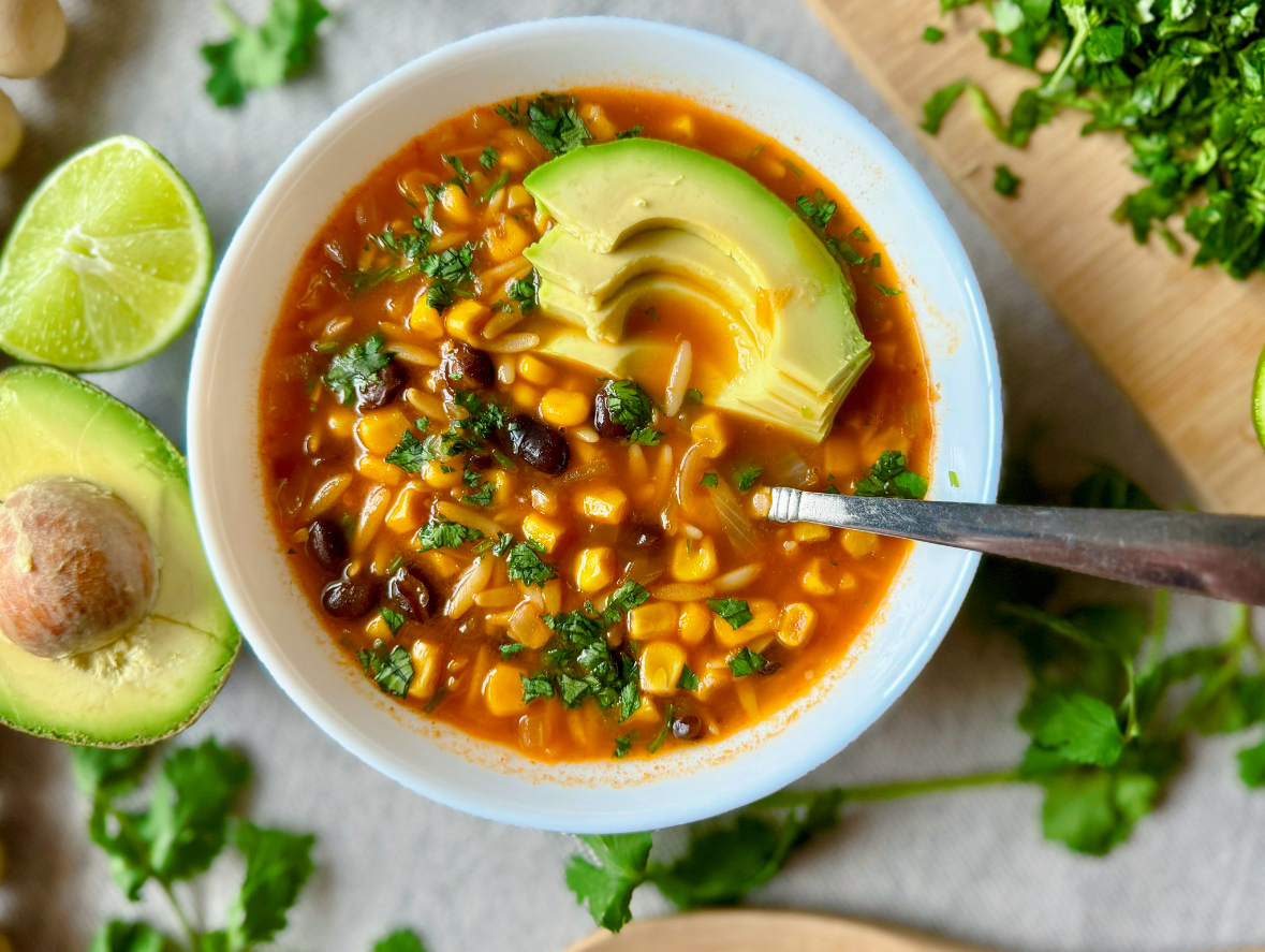 bowl of soup with black beans, corn and orzo pasta