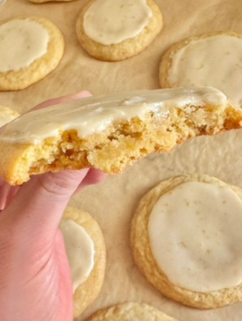orange creamsicle cookies split in half to show the soft, chewy center inside