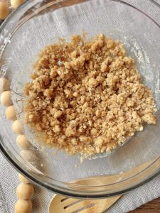 glass bowl with cinnamon brown sugar streusel toppings