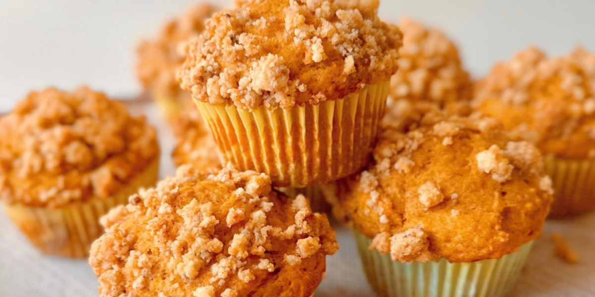 close up of a greek yogurt pumpkin muffin with cinnamon brown sugar streusel topping